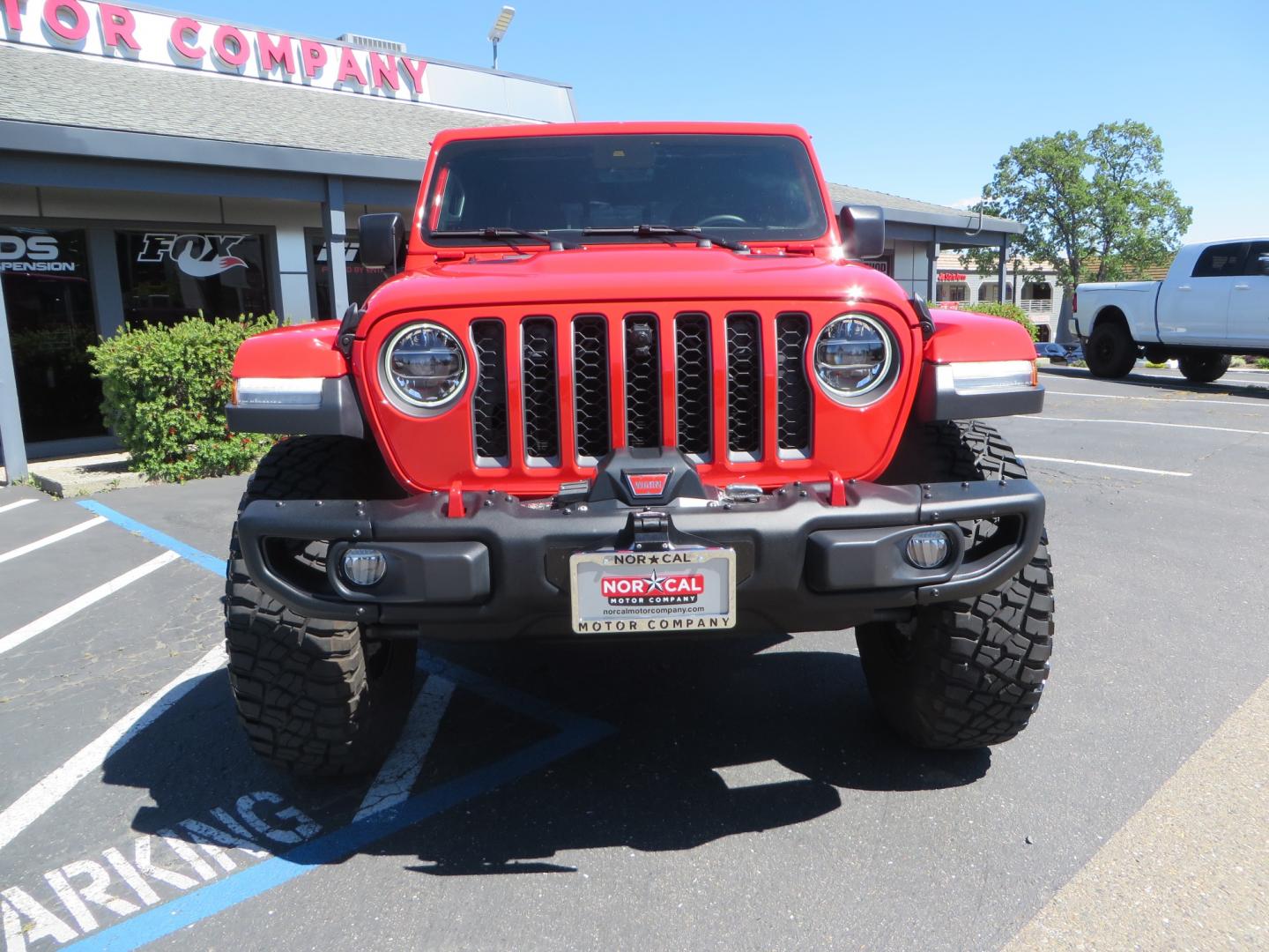 2020 Red /black Jeep Gladiator Rubicon (1C6JJTBG6LL) with an 3.6L V6 DOHC 24V engine, 6M transmission, located at 2630 Grass Valley Highway, Auburn, CA, 95603, (530) 508-5100, 38.937893, -121.095482 - Rubicon Gladiator featuring a Mopar suspension system with Fox shocks, 17" AEV wheels wrapped in 37" BFG tires, Warn Winch, Rock sliders, Cascade front license plate holder, Impact bedliner, Built Right Industries bed Molle panels, and Window tint. - Photo#1